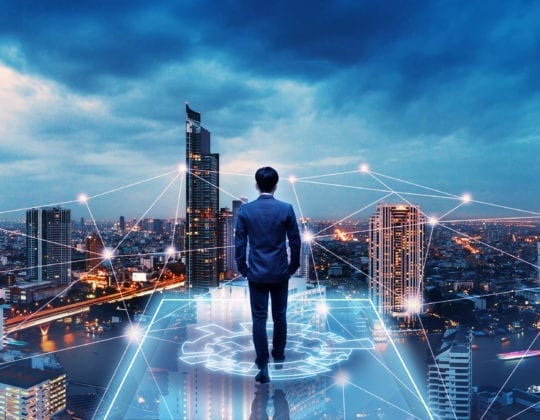 Business technology concept, Professional business man walking on future network city background and futuristic interface graphic at night, Cyberpunk color style.