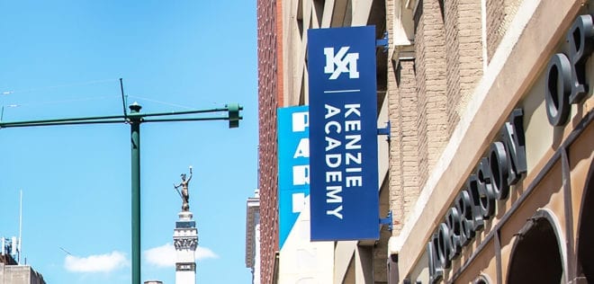Kenzie Academy logo on flag outside offices
