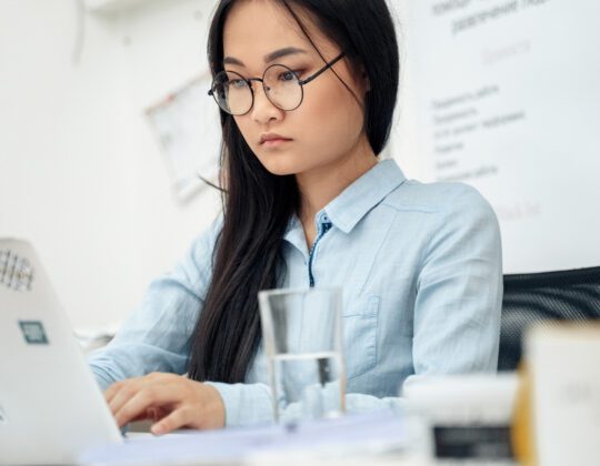 female asian learning to code
