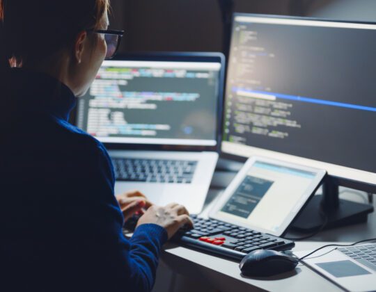 woman coding java on computer